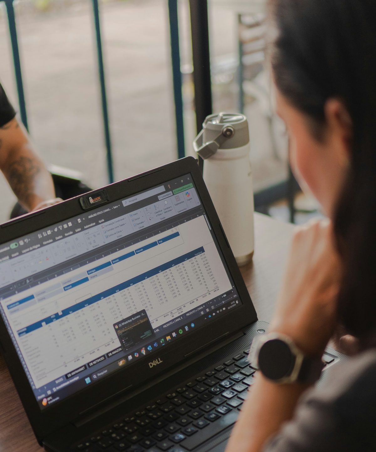 Cost line items being reviewed in a spreadsheet on a laptop