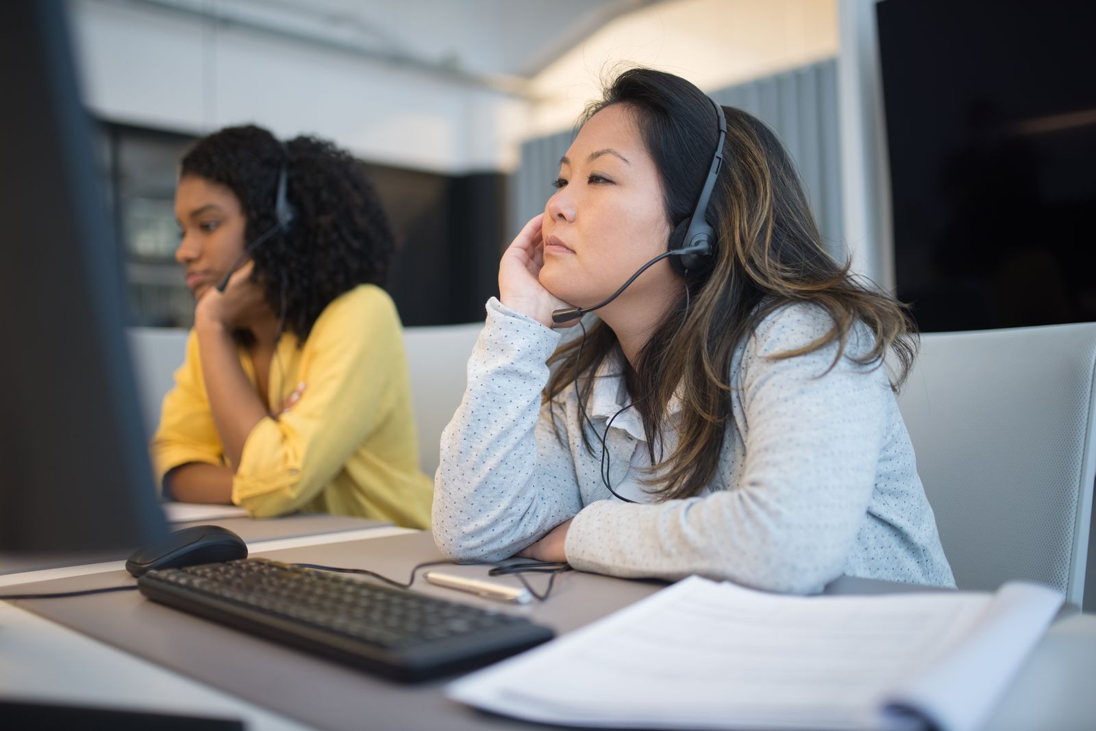 Team on calls with headsets in the office