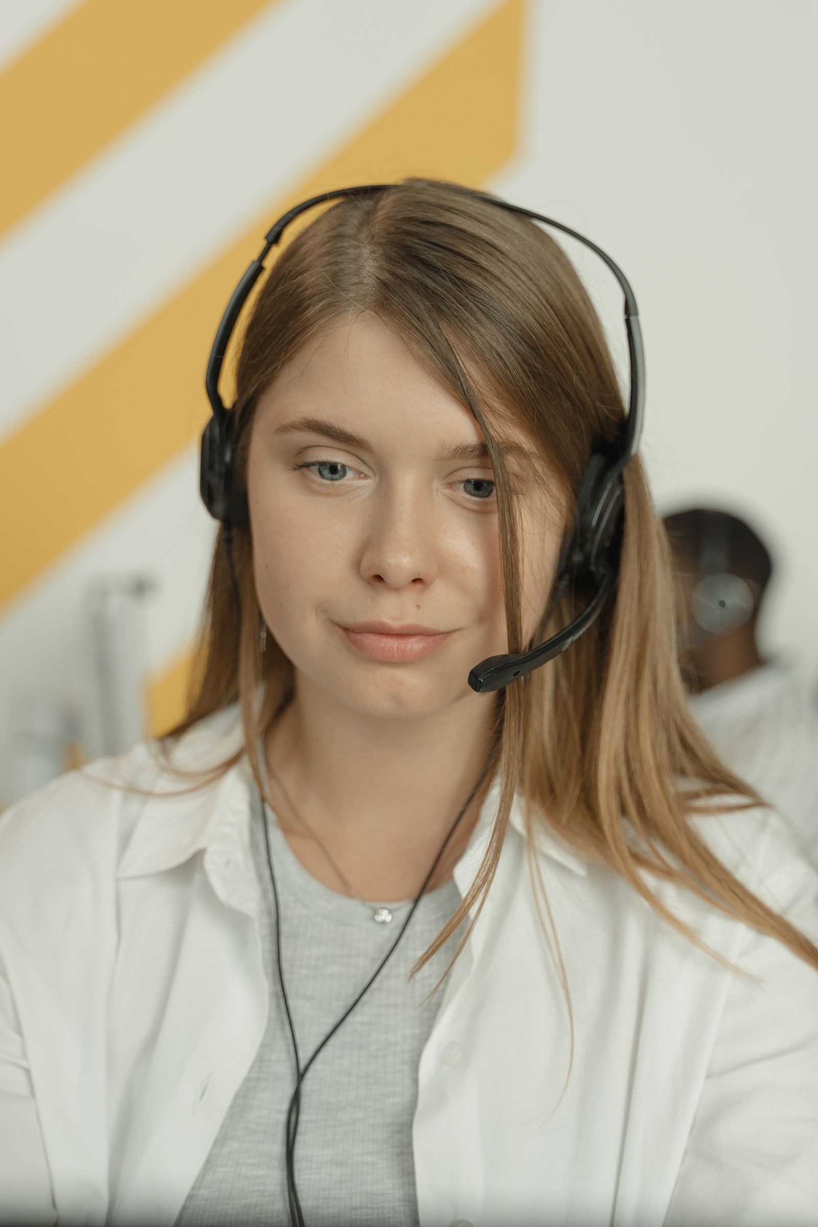 Employee with a headset on a call via Microsoft Teams